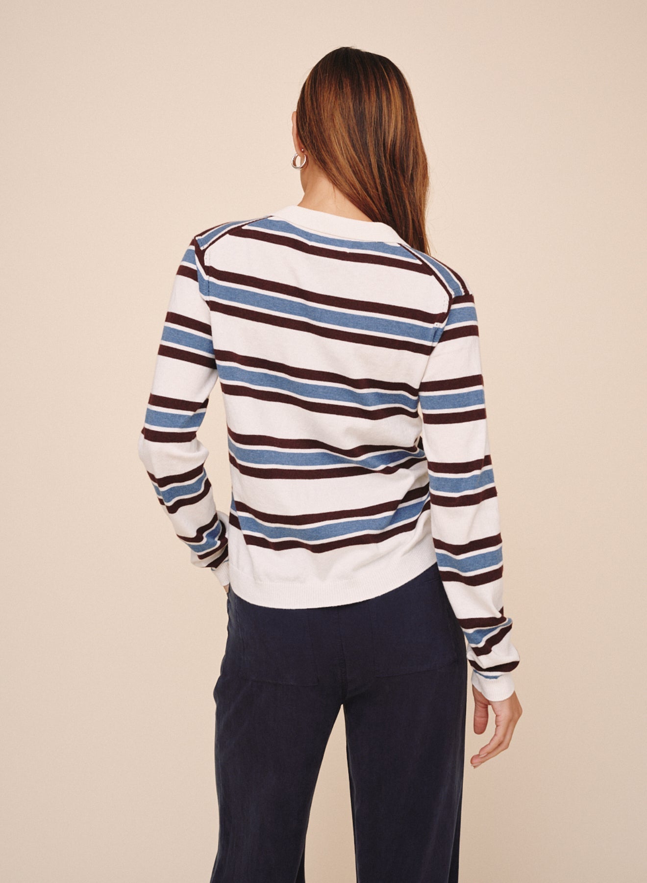 Back view of model wearing Bella Dahl long sleeve striped pullover in garnet stripe colorway