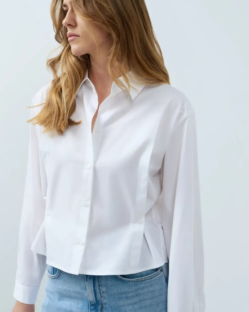 White long-sleeve poplin button-front blouse with spread collar and wide cuffs