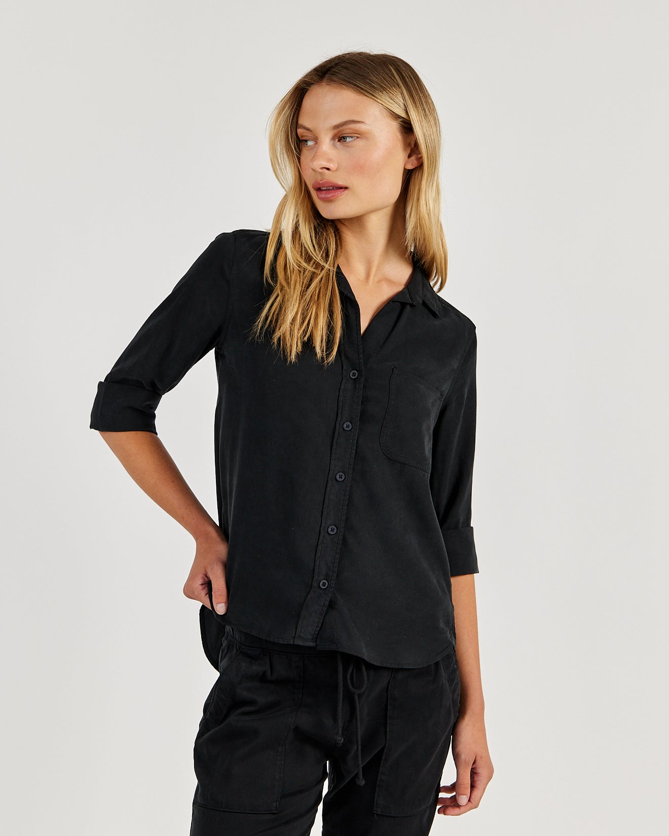 Model wearing Bella Dahl black button-down shirt with three-quarter sleeves and chest pocket