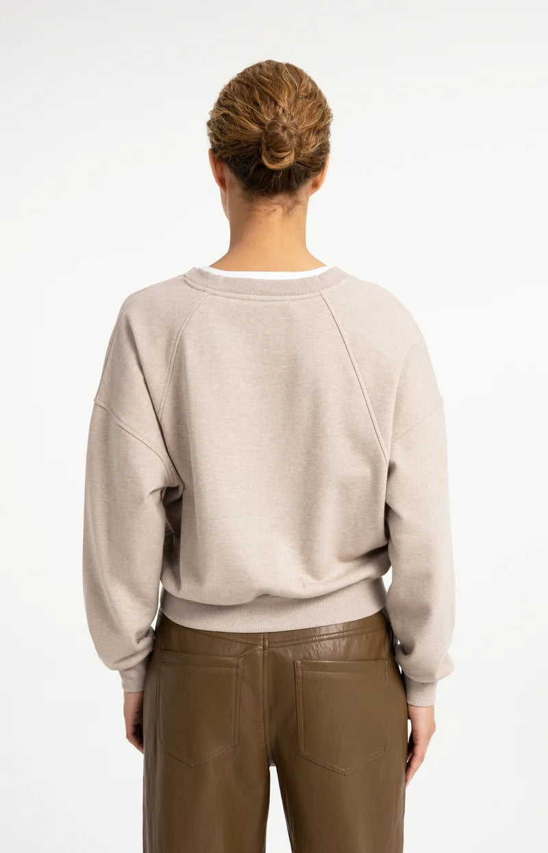 Beige heathered raglan sweatshirt with V-neck woven white collar, back view