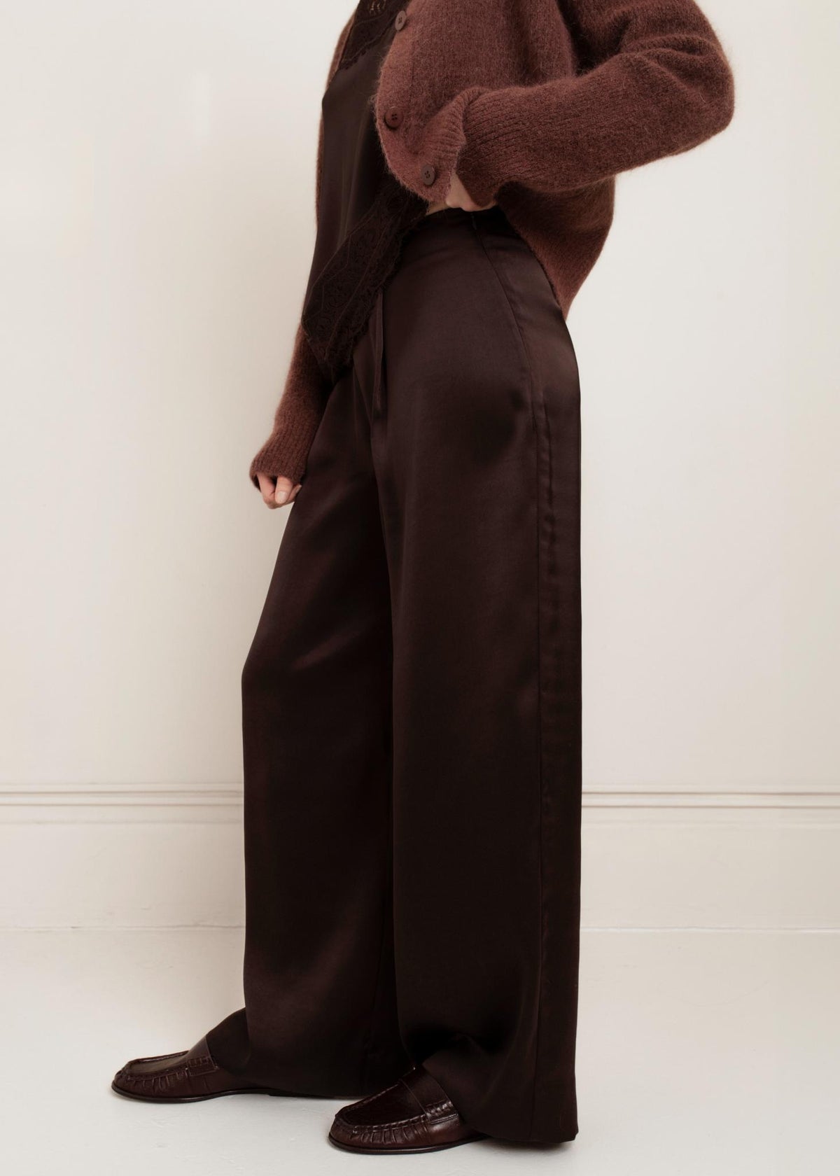 Side view of Paper Label Cindy Pant in Chocolate Torte satin wide-leg style with loafers