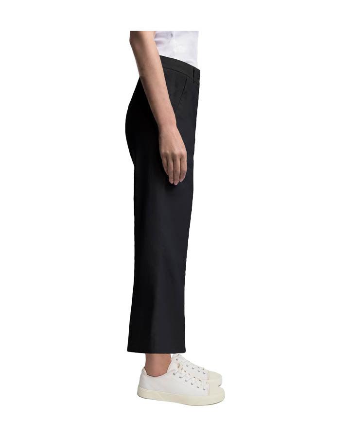 Cambio California wide-leg cropped black trousers styled with white sneakers, side view.