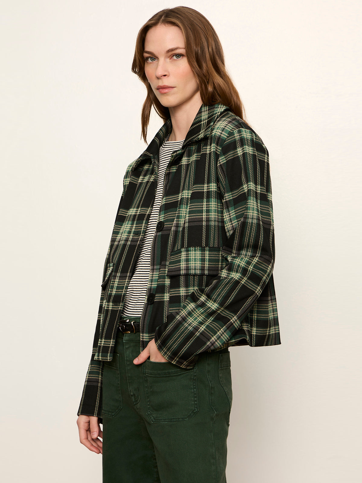 Woman wearing Sanctuary Avid Plaid Jacket in dark green and black tartan plaid pattern