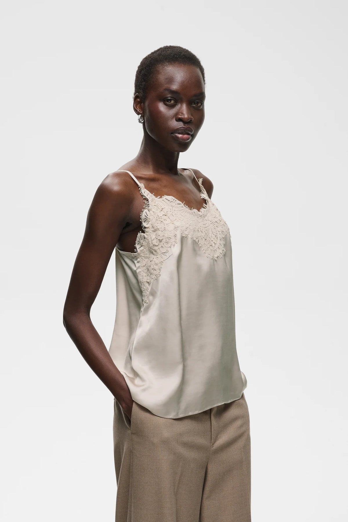 Sage satin camisole with lace trim neckline and thin straps
