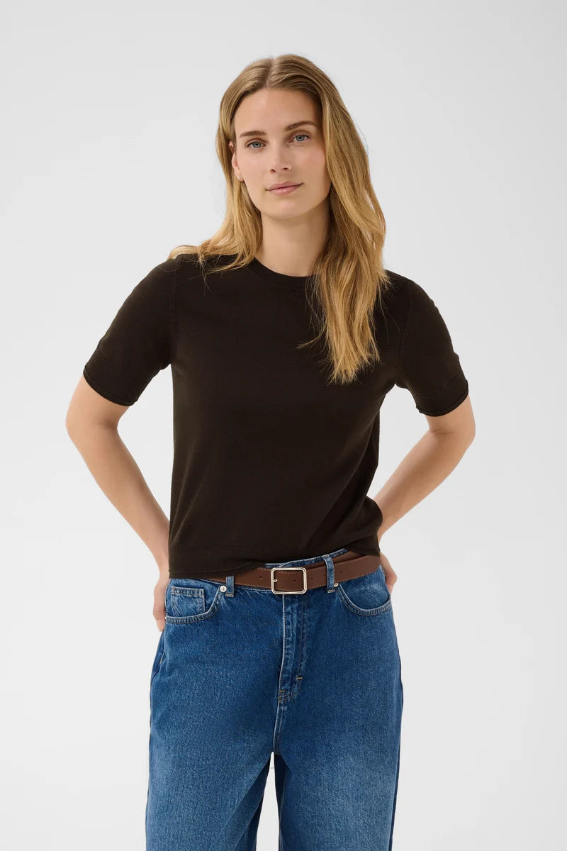 Part Two Natanya black short-sleeve knit pullover with crew neck, styled with blue jeans.