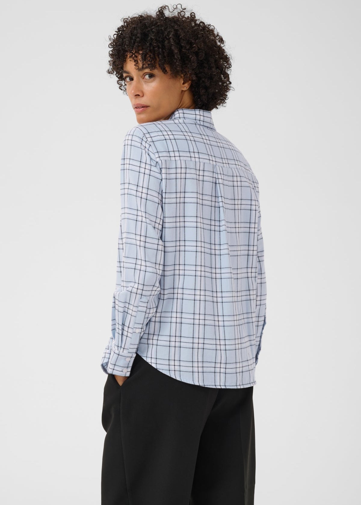 Back view of model wearing Part Two Yana Shirt in light blue heather check plaid pattern
