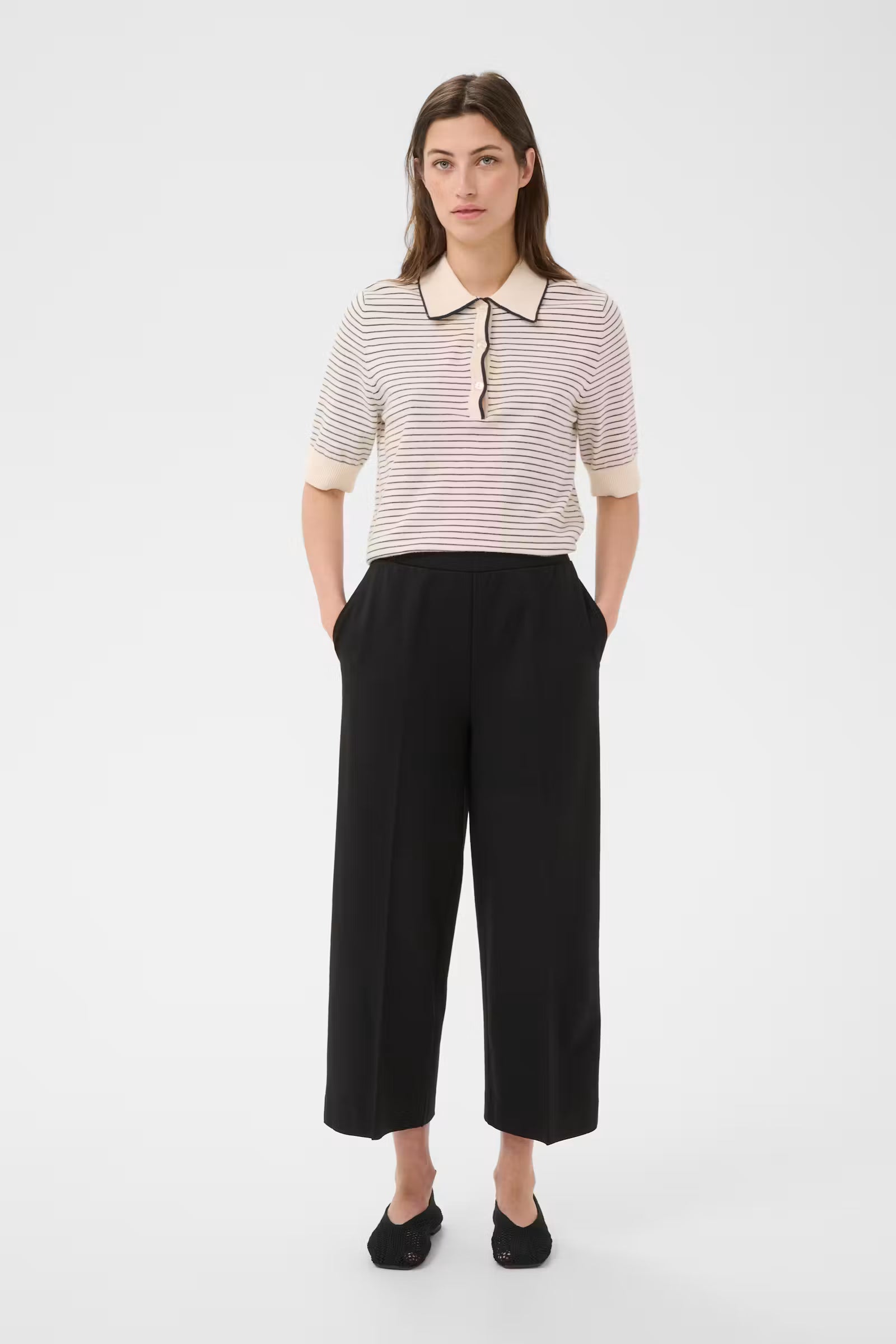 Black wide-leg cropped trousers with clean waistband and side pockets, ankle length