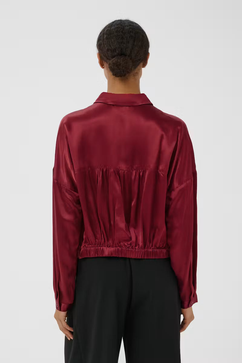 Part Two Dynya Shirt in deep red satin with elastic hem, back view