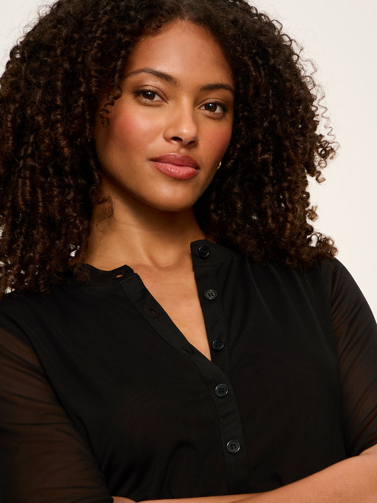 Model wearing black mesh long sleeve cardigan with button front detail by Sanctuary