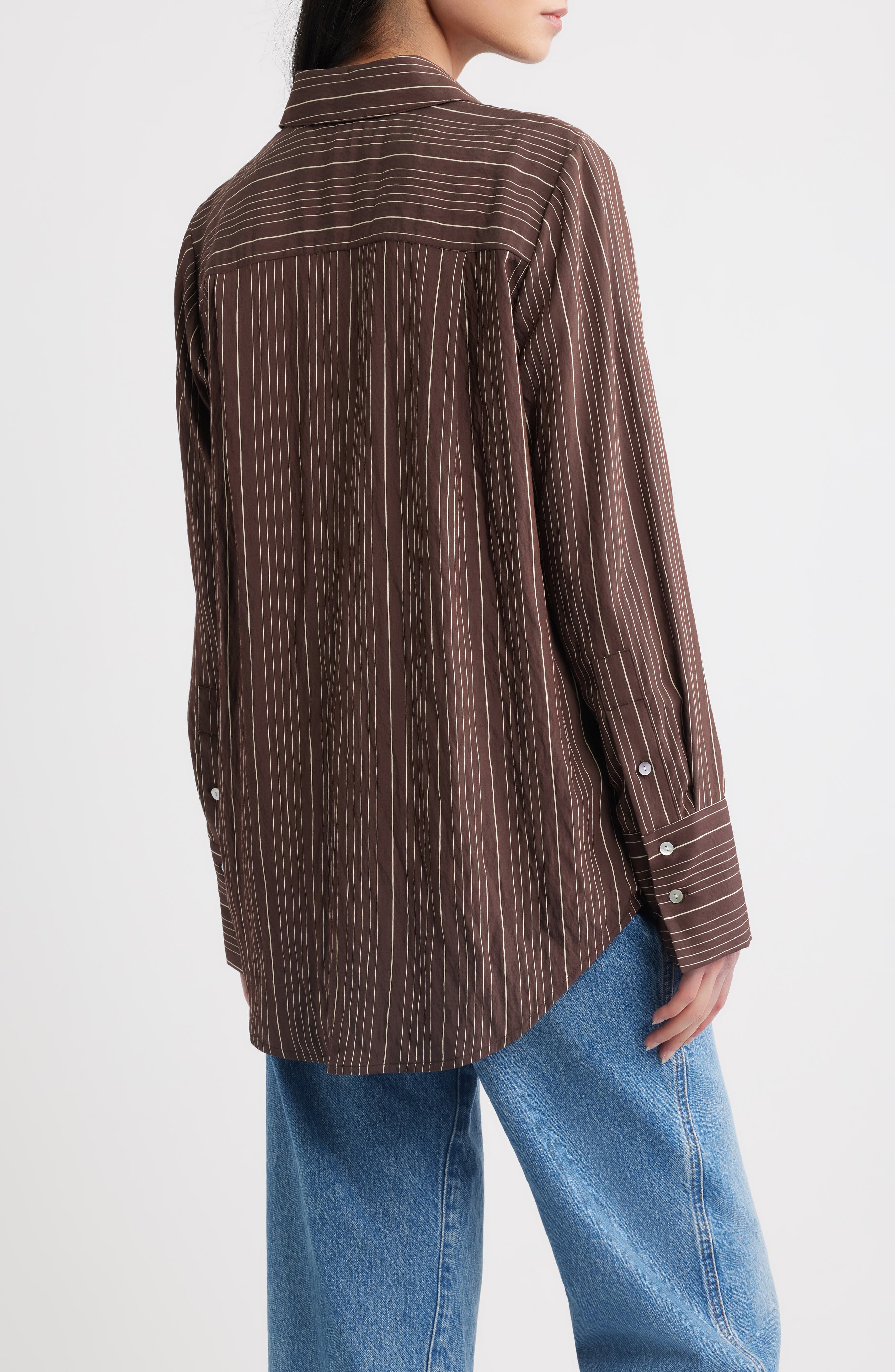 Back view of Rails Beck oversized button-down shirt in hickory indigo stripe pattern with blue jeans