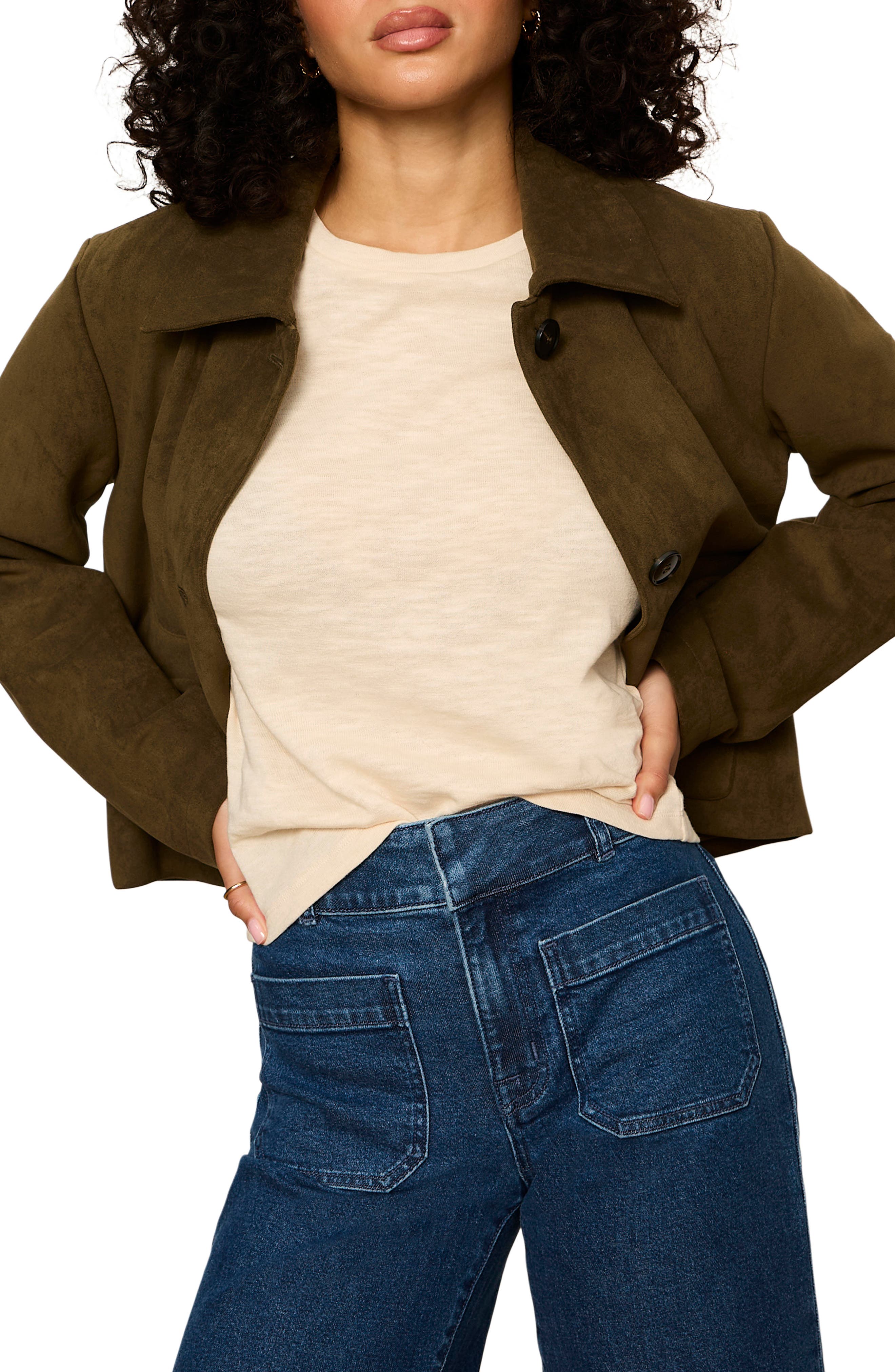 Model wearing Sanctuary Avid Suede Jacket in Light Kalamata olive green over cream tee with jeans