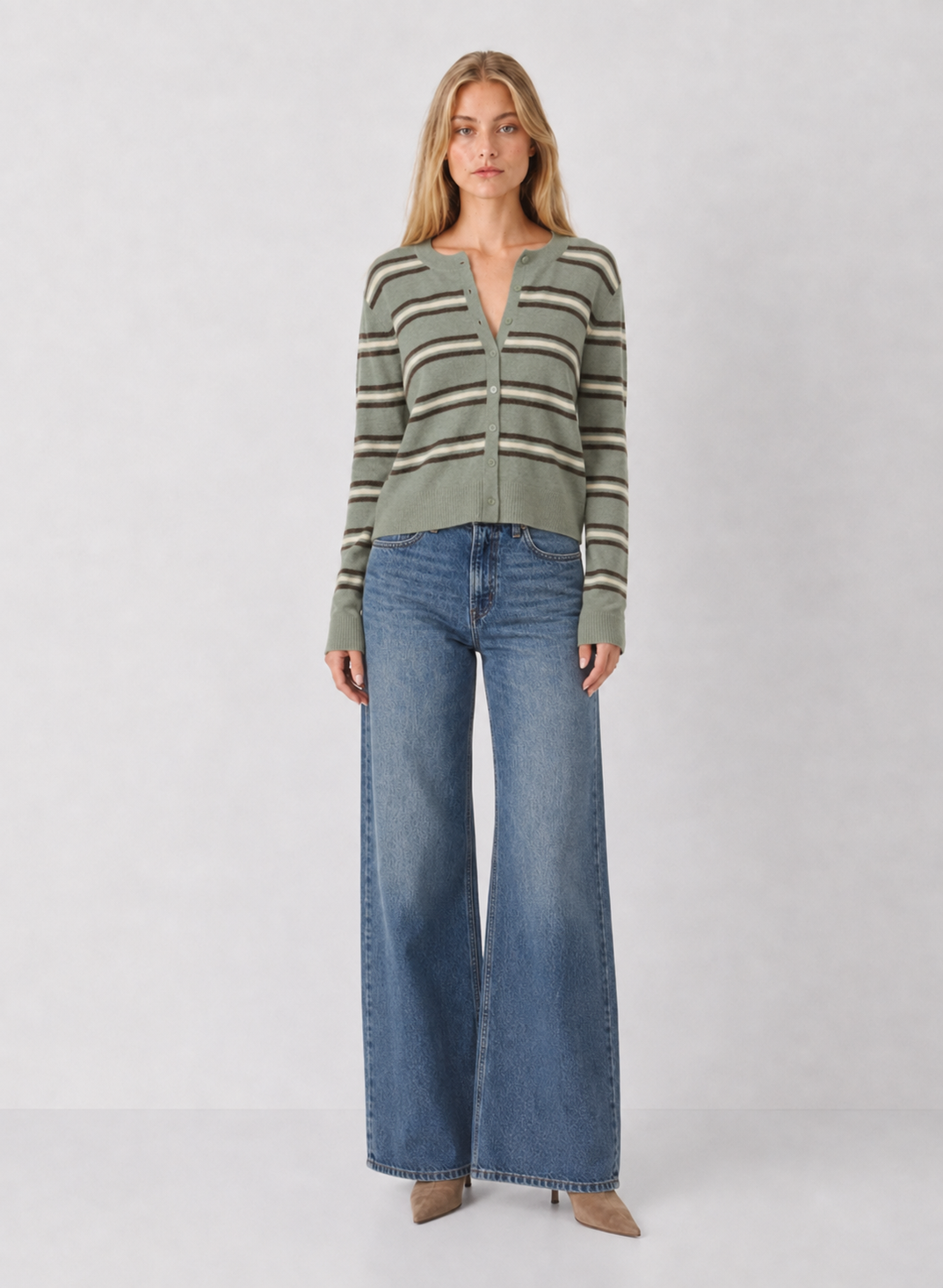 Woman wearing Z Supply Medina Stripe Cardigan in Aqua Cloud sage green with horizontal stripes