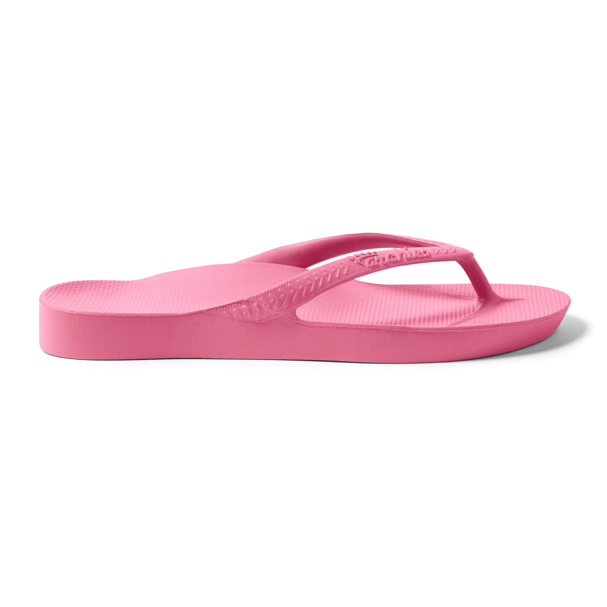 Archies hot pink arch support flip flops shown in side profile view on white background