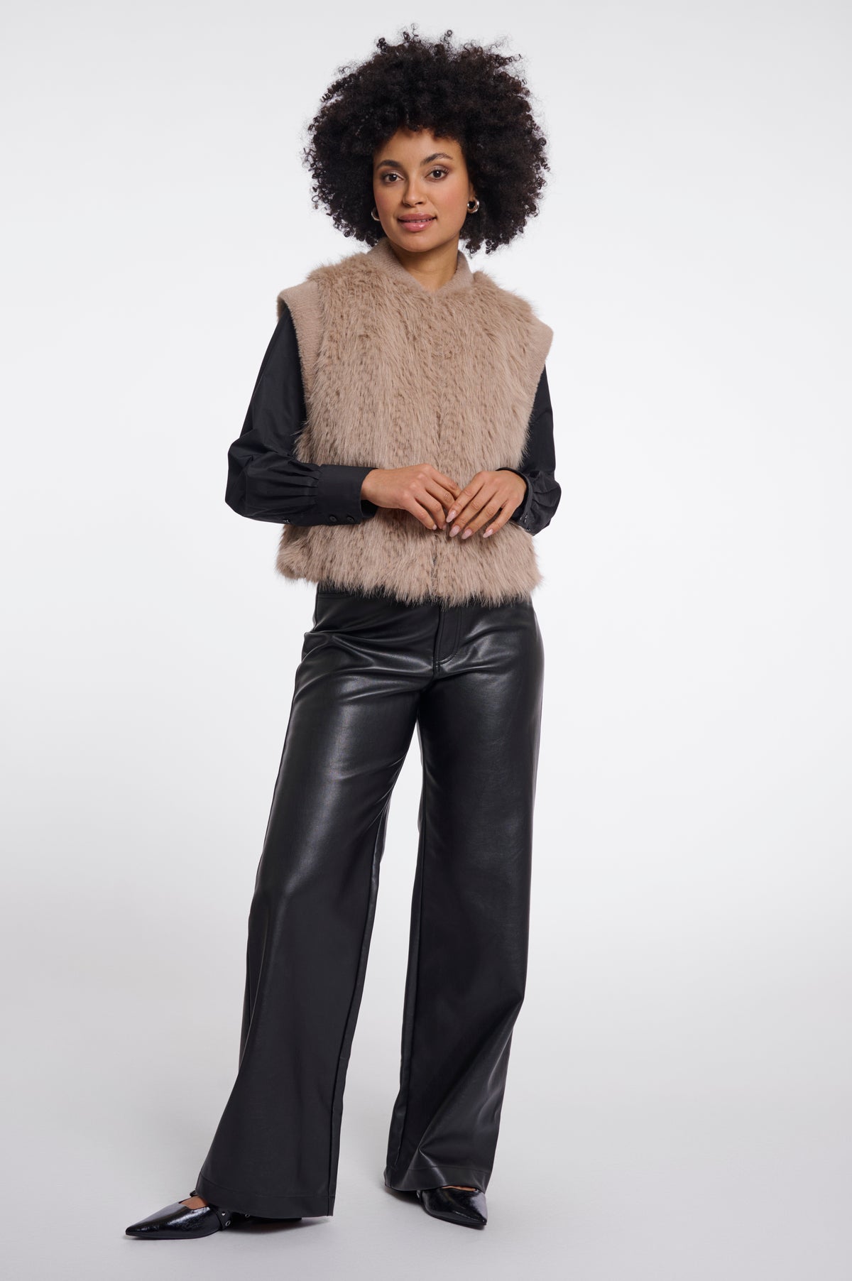 RINO & PELLE Alvita taupe faux fur sleeveless vest worn over black leather shirt and trousers