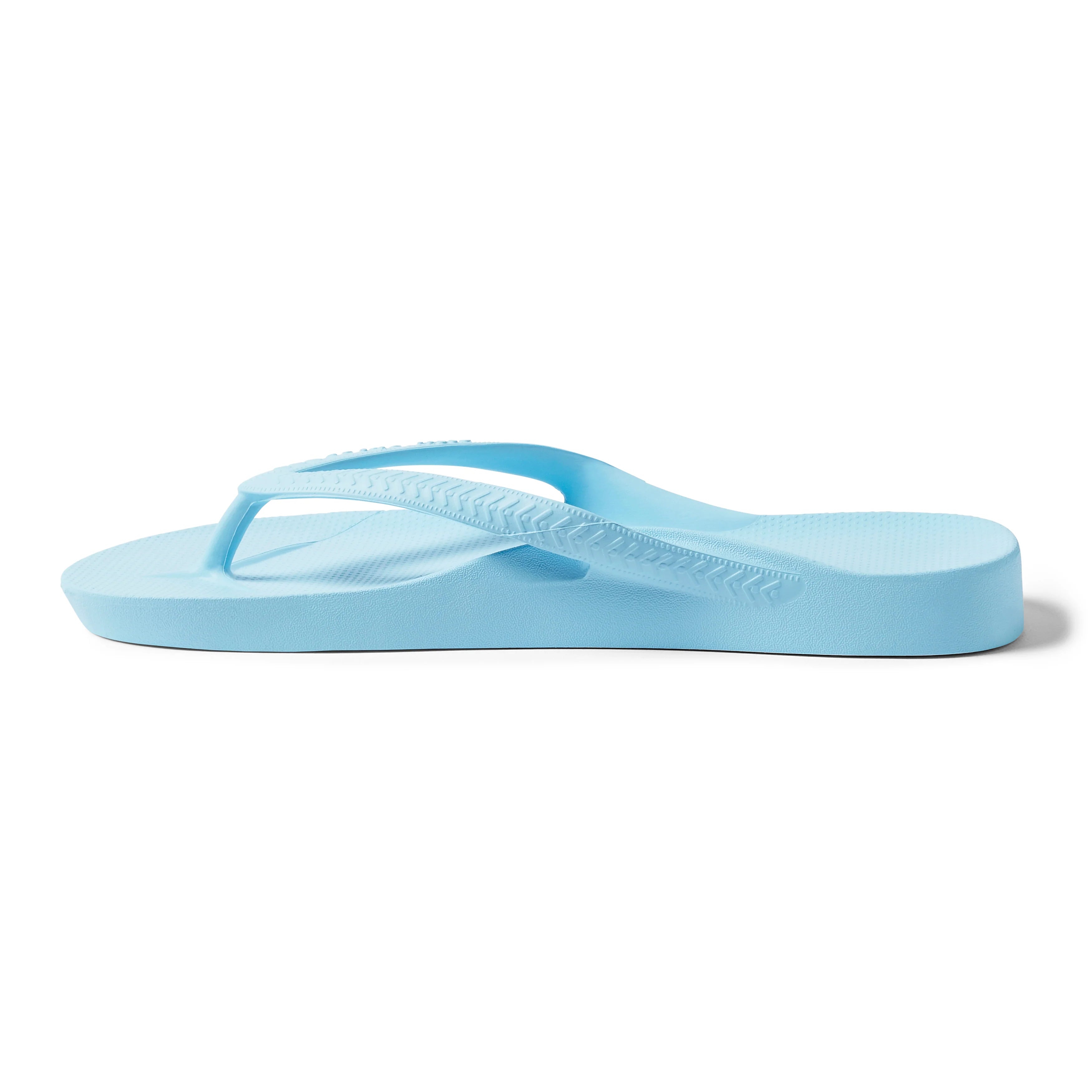 Archies sky blue arch support flip flop shown in side profile view on white background