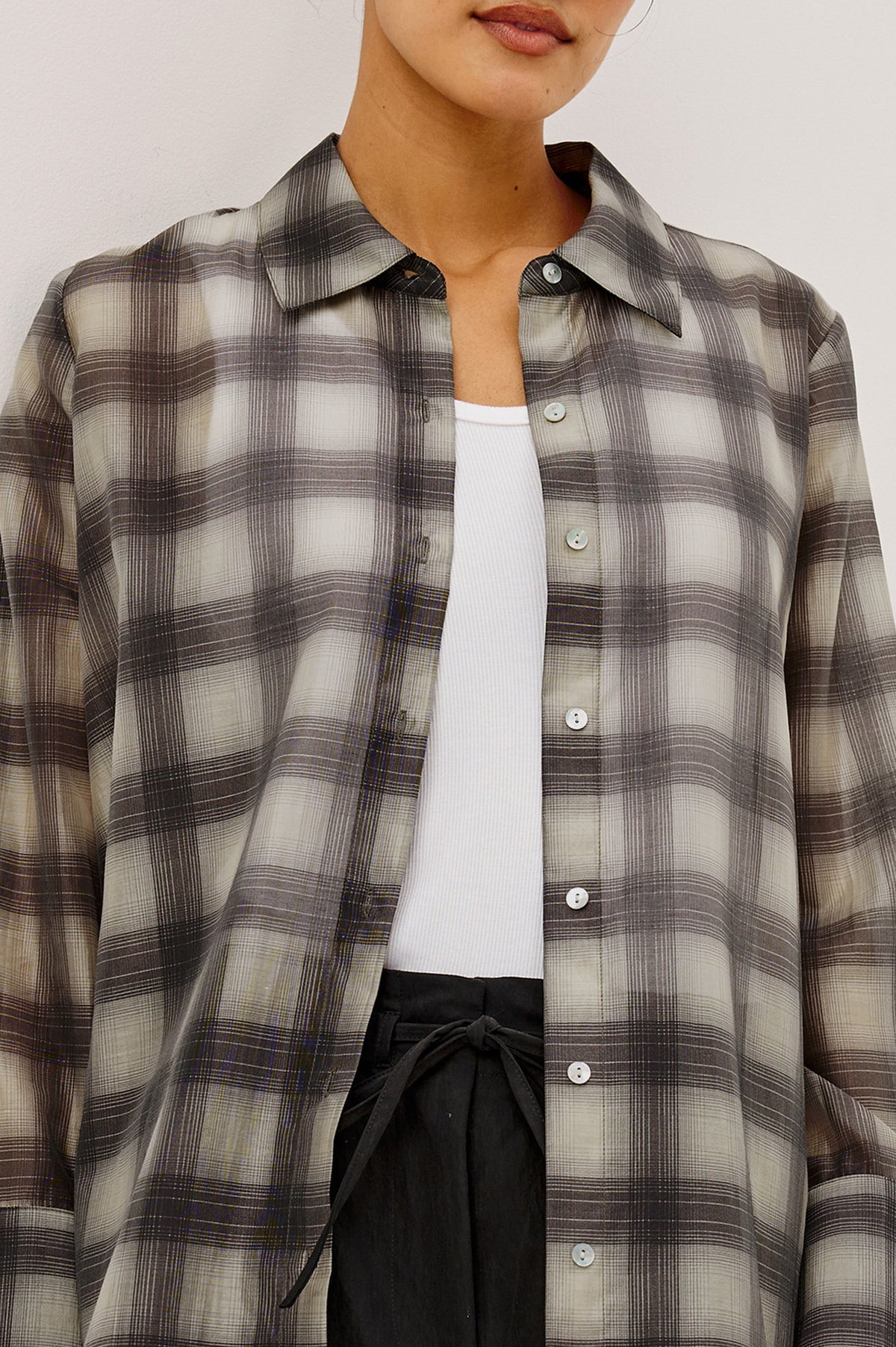 Rails Bishop shirt in onyx-taupe plaid, worn open over white ribbed tank top