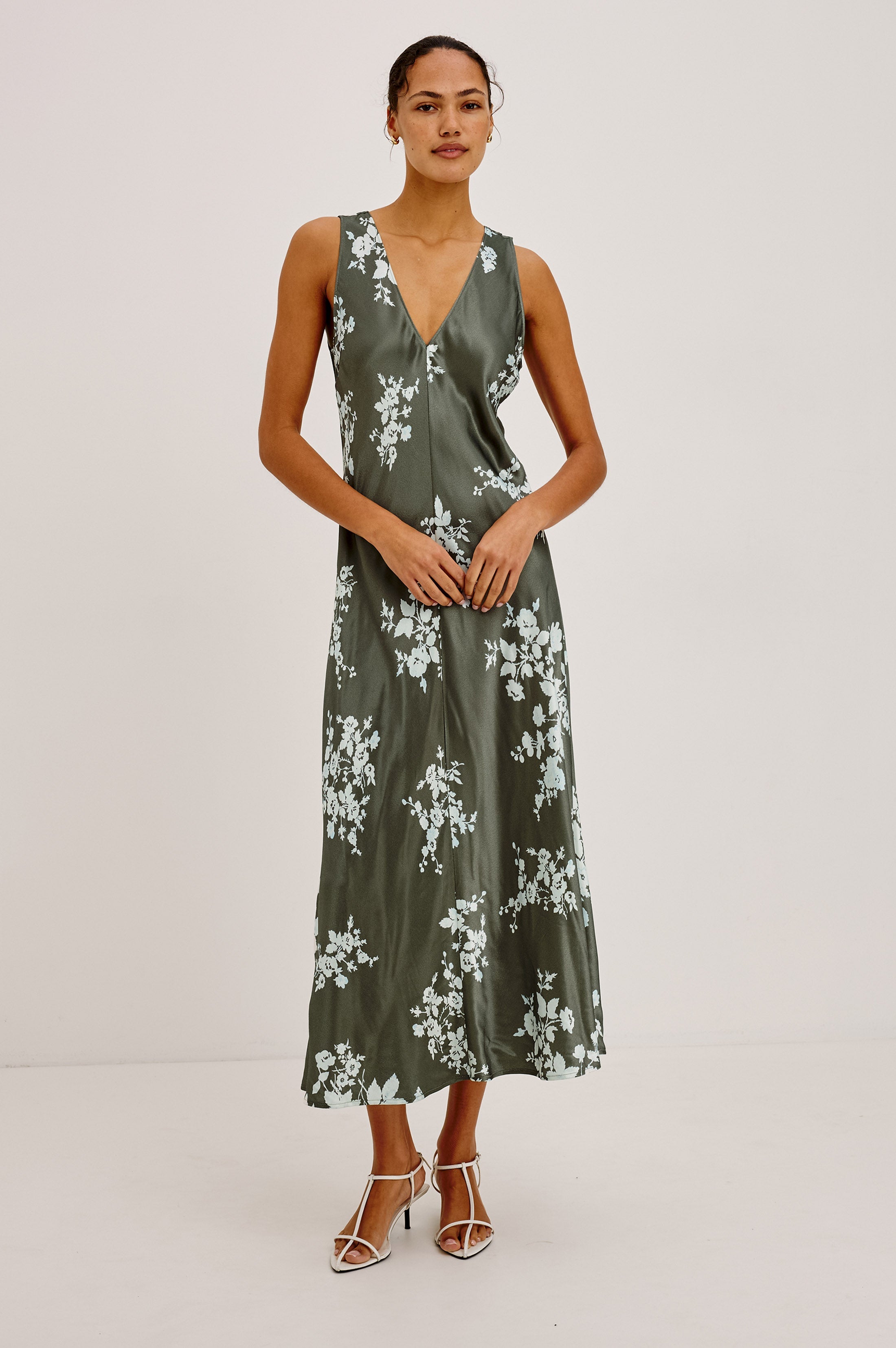 Model wearing Rails Camellia midi dress in olive green lace floral print with V-neck