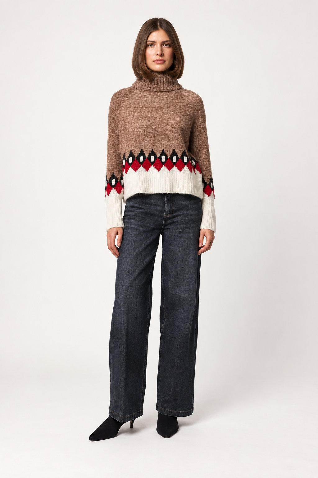 Model wearing Line the Label LOUISA turtleneck sweater in Fireplace Crackle colorway with dark jeans