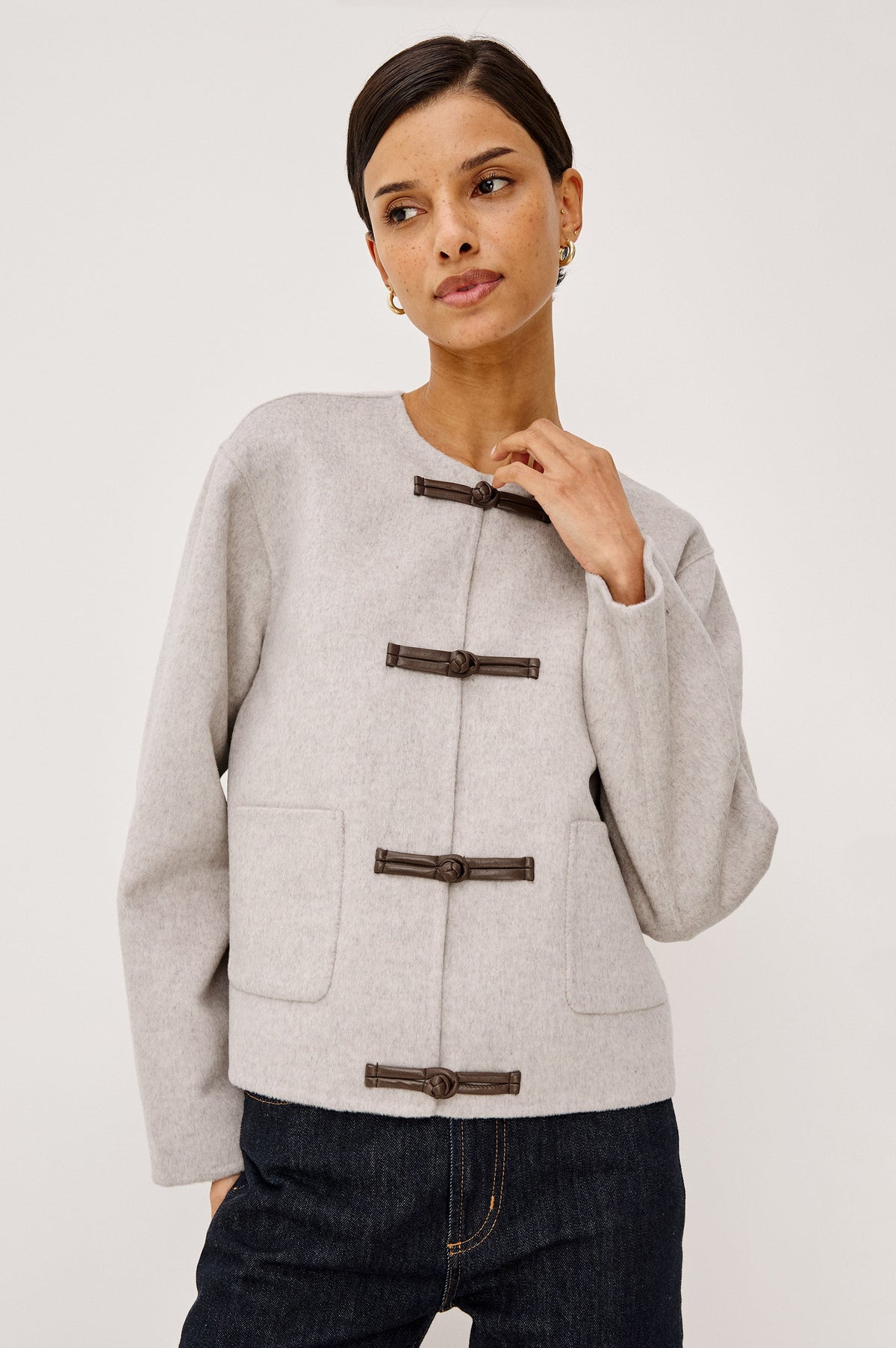 Model wearing Rails Deidre wool jacket in heather oat with toggle closures and patch pockets