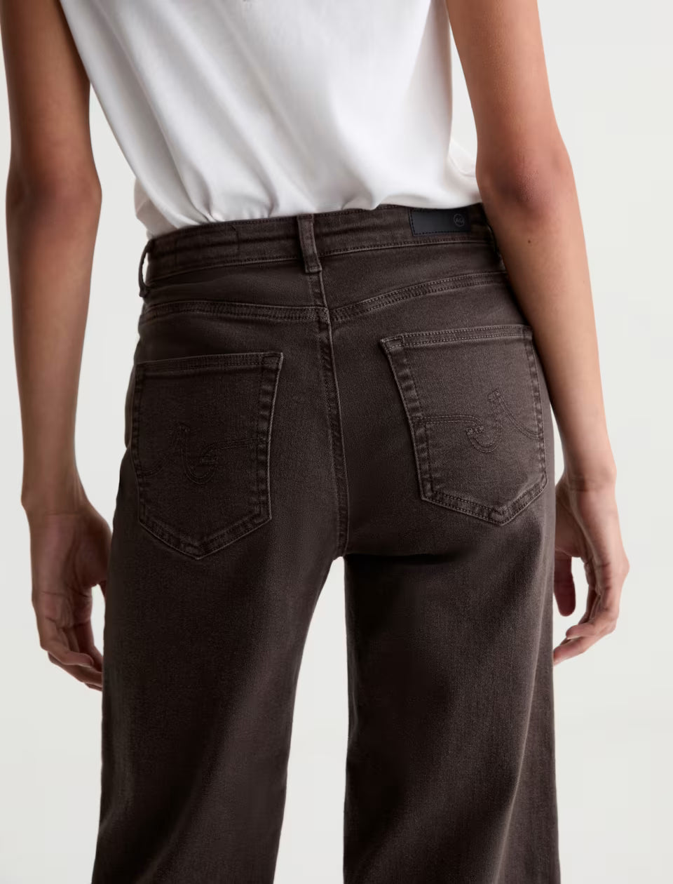 AG Saige wide leg crop jeans in sulfur burnt umber, back view with logo pockets