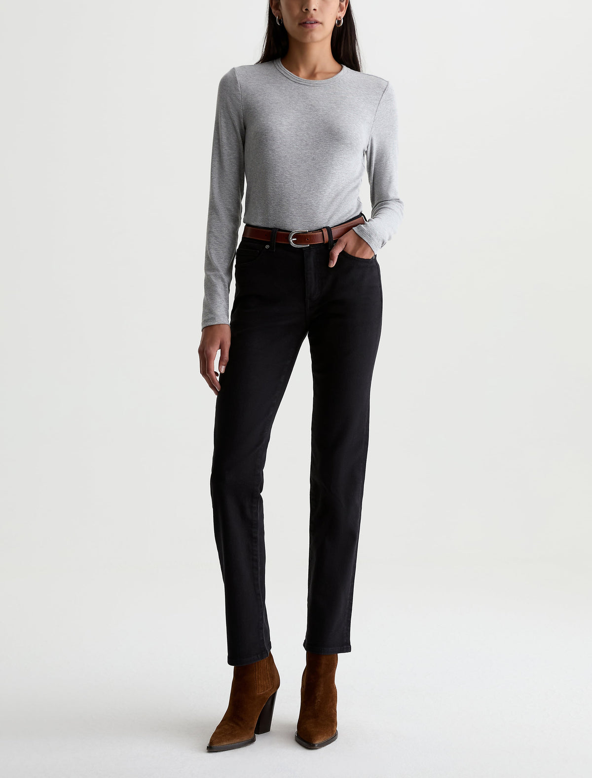Model wearing AG Sandra straight-leg jeans in super black with gray long-sleeve top