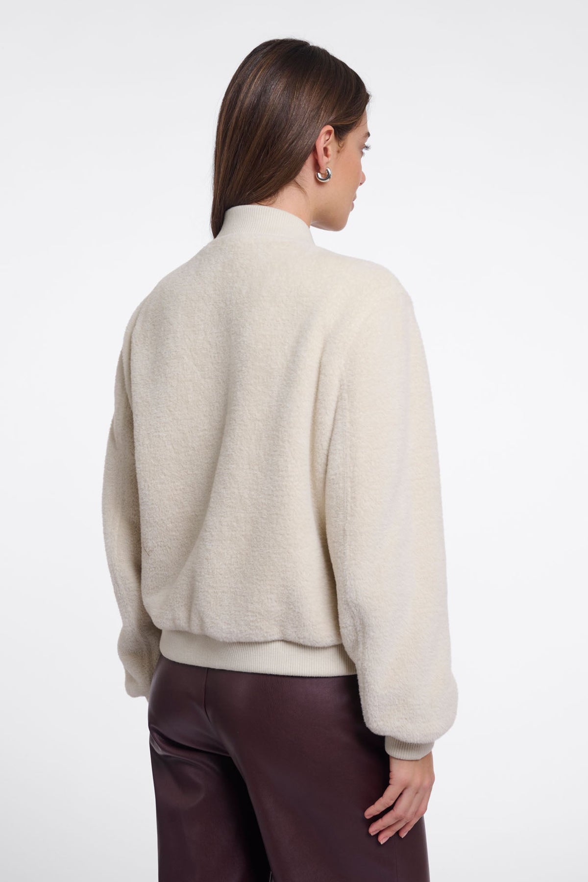 Back view of RINO & PELLE FELIX bomber jacket in birch cream boucle fabric with ribbed hem.