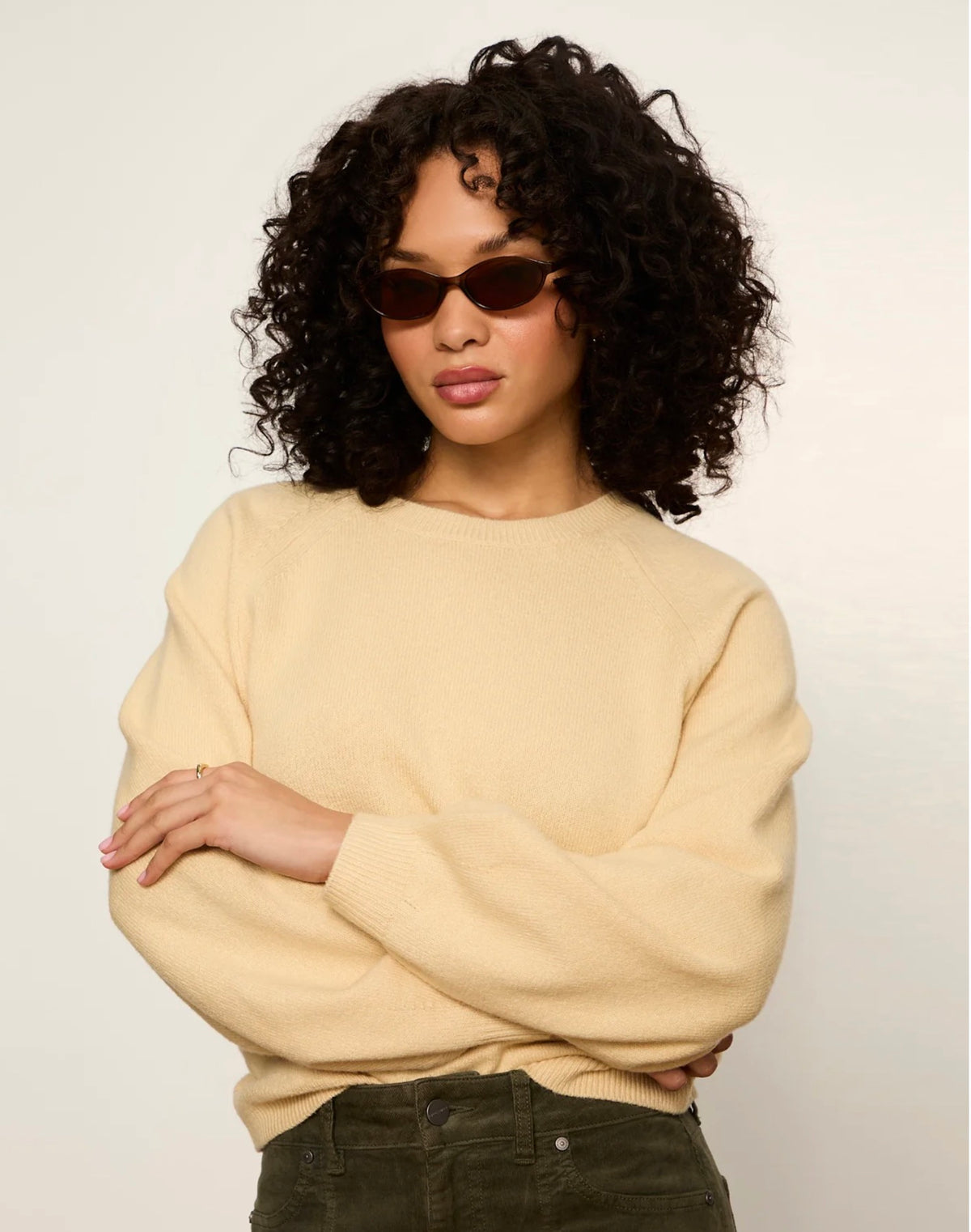 Cream lightweight knit pullover sweater with dolman sleeves and ribbed cuffs