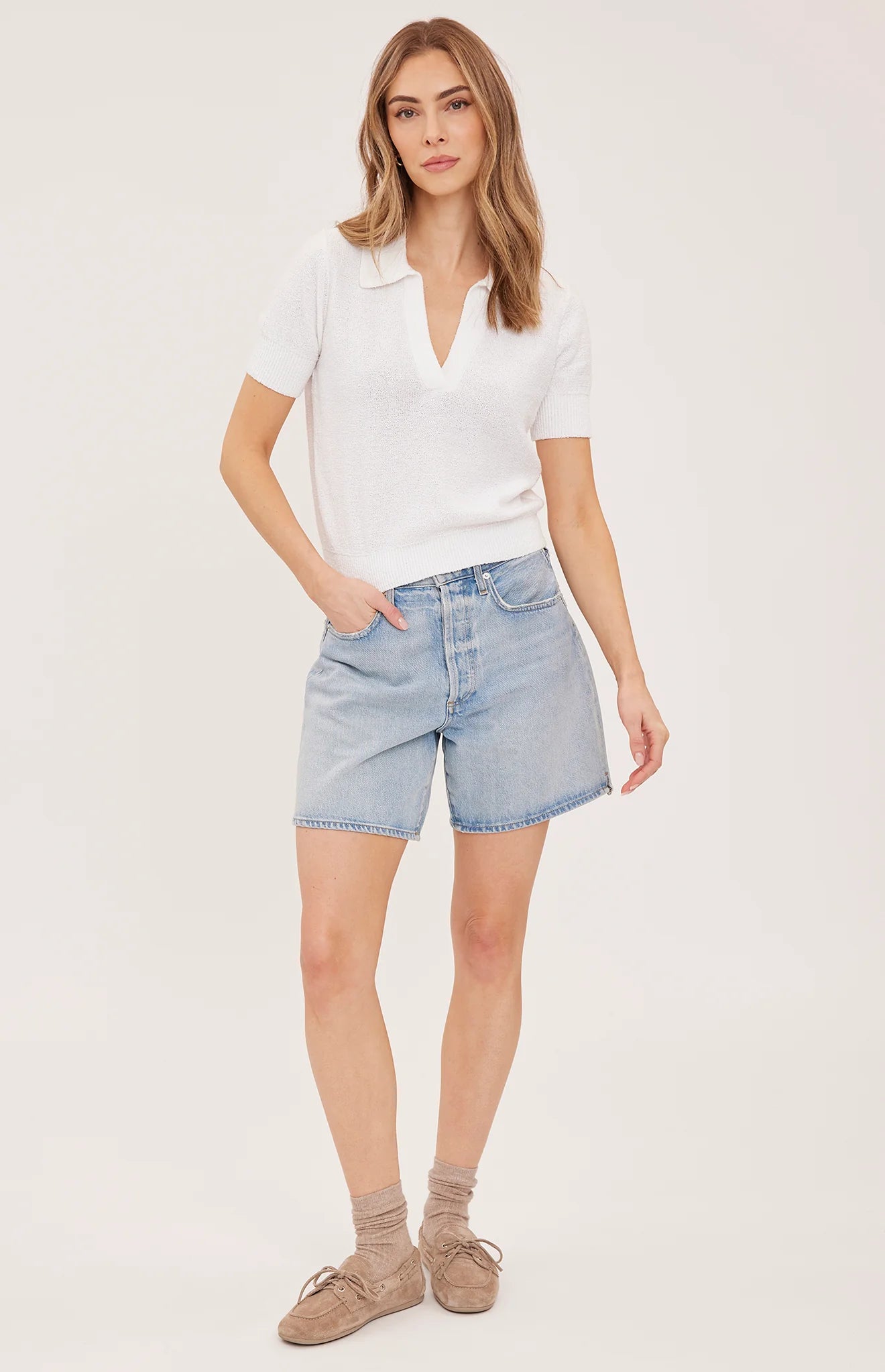 Gentle Fawn Tatum white short-sleeve knit polo sweater on model with denim shorts