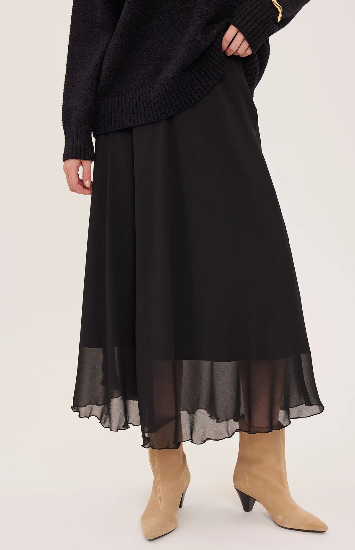 Gentle Fawn Arianna black midi skirt with sheer chiffon hem worn with tan boots