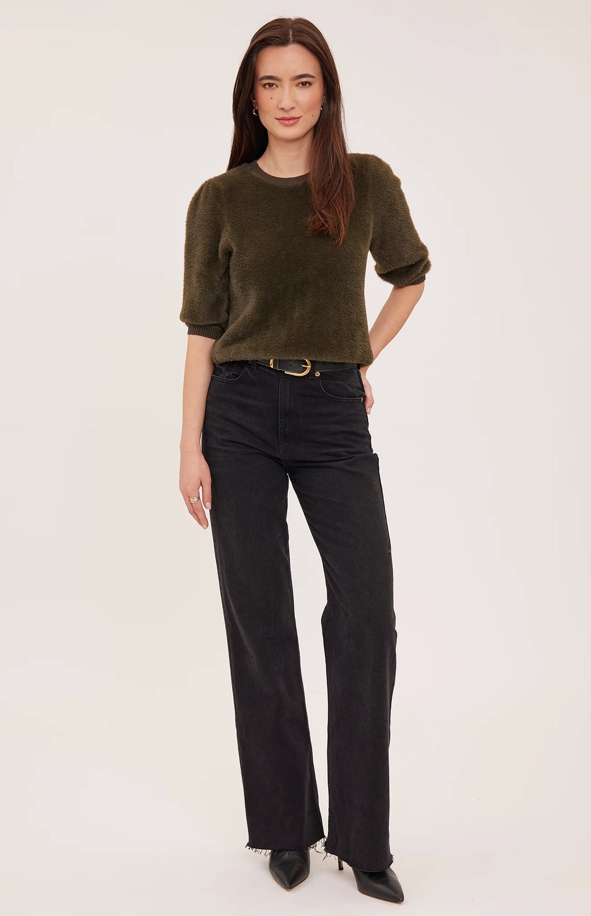 Olive green fuzzy short puff sleeve crewneck sweater paired with black wide-leg jeans