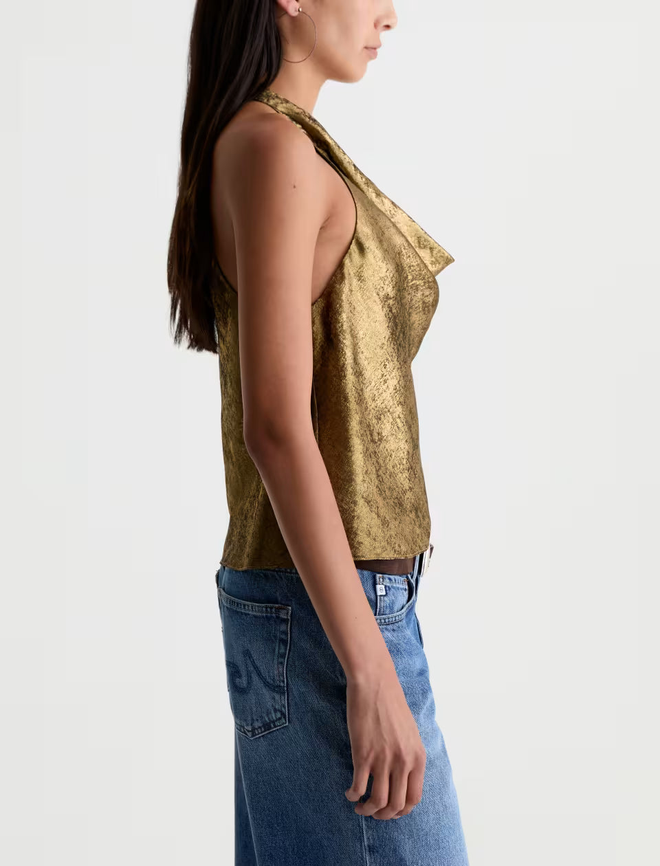 AG Kacey gold metallic halter top paired with blue denim jeans, side view