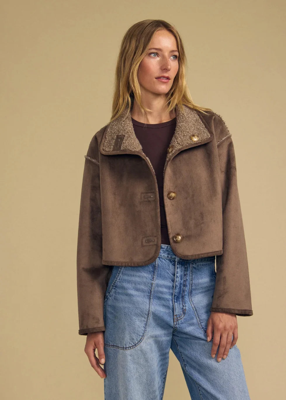 Cropped brown shearling jacket with gold buttons and teddy fleece collar