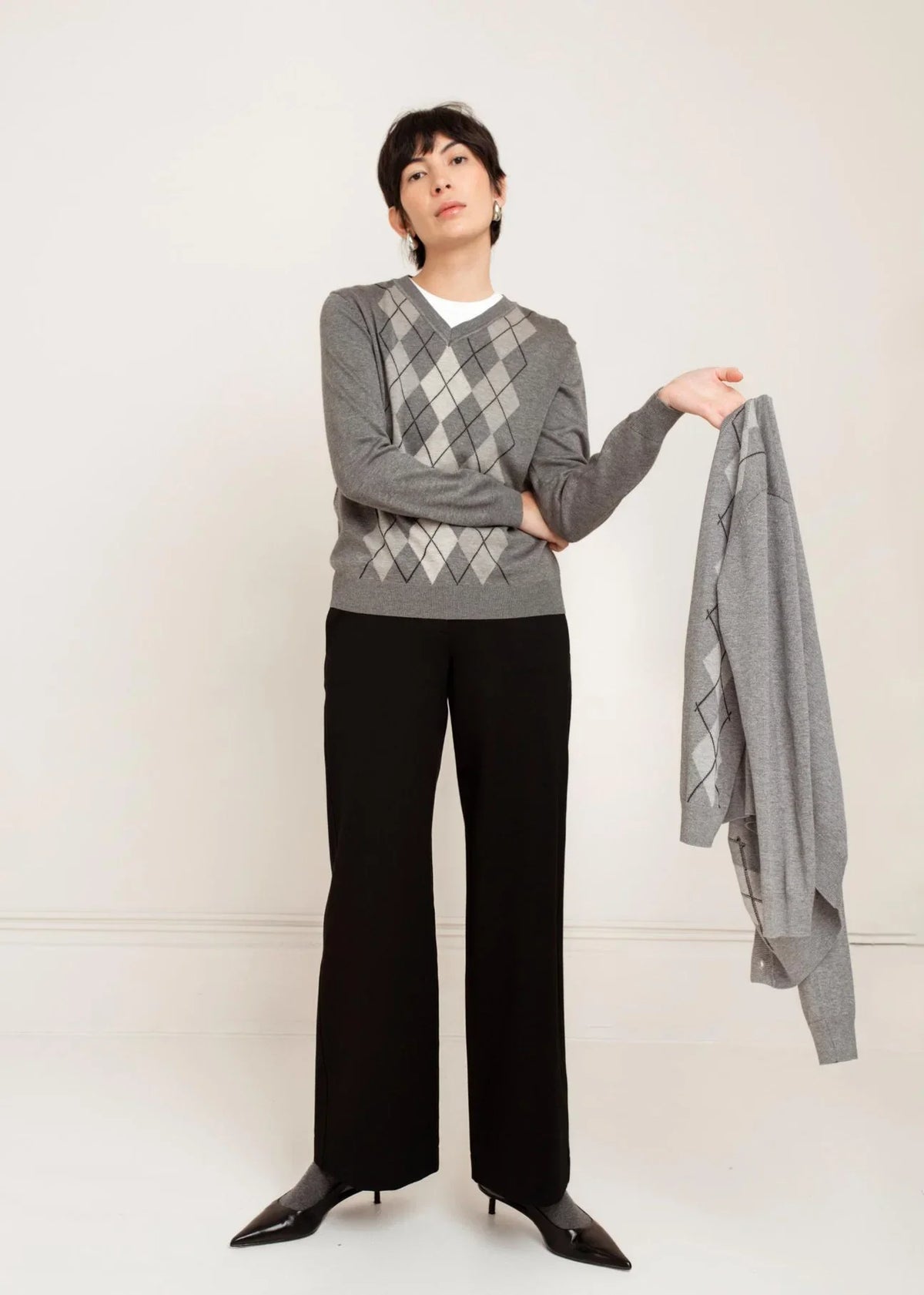 Black wide-leg dress pants with a clean, tailored silhouette and full-length cut.