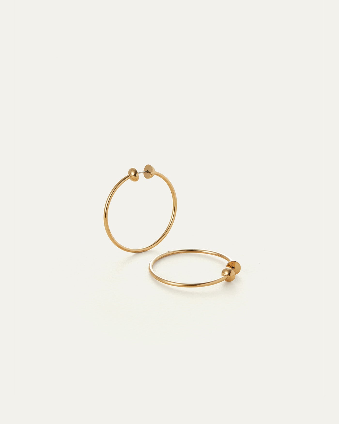 Jenny Bird Mini Icon Hoops in gold, two thin circular earrings with ball closures