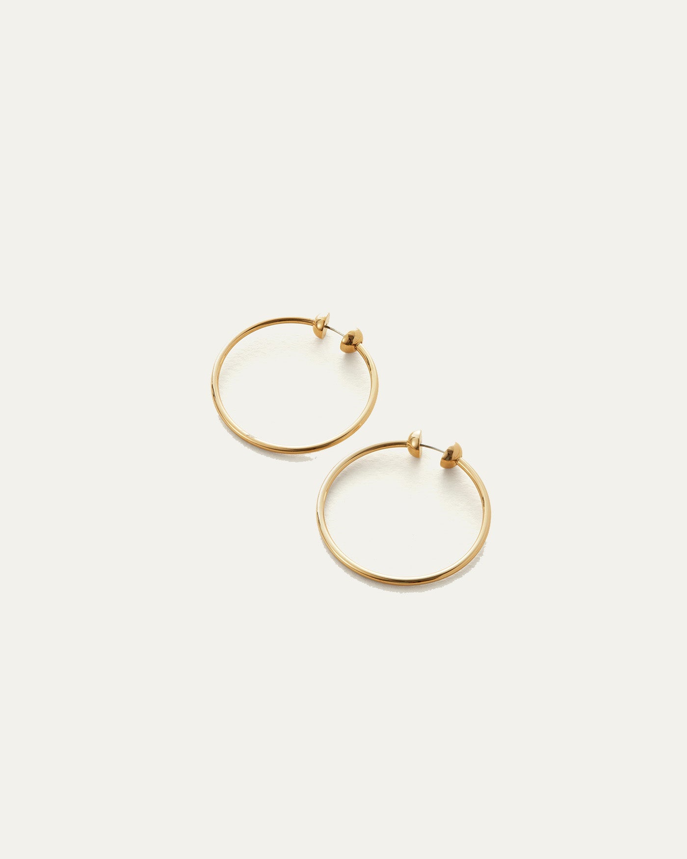 Jenny Bird Mini Icon Hoops in gold, pair of simple thin circular earrings with ball closure