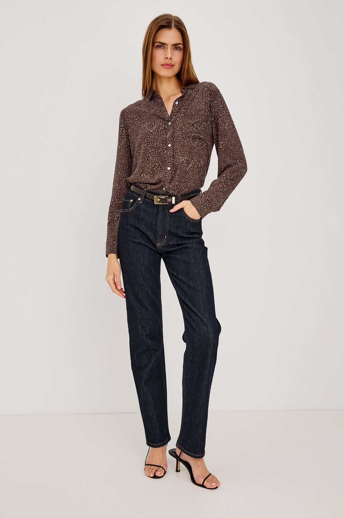 Model wearing Rails Josephine blouse in cocoa mini cheetah print with dark jeans