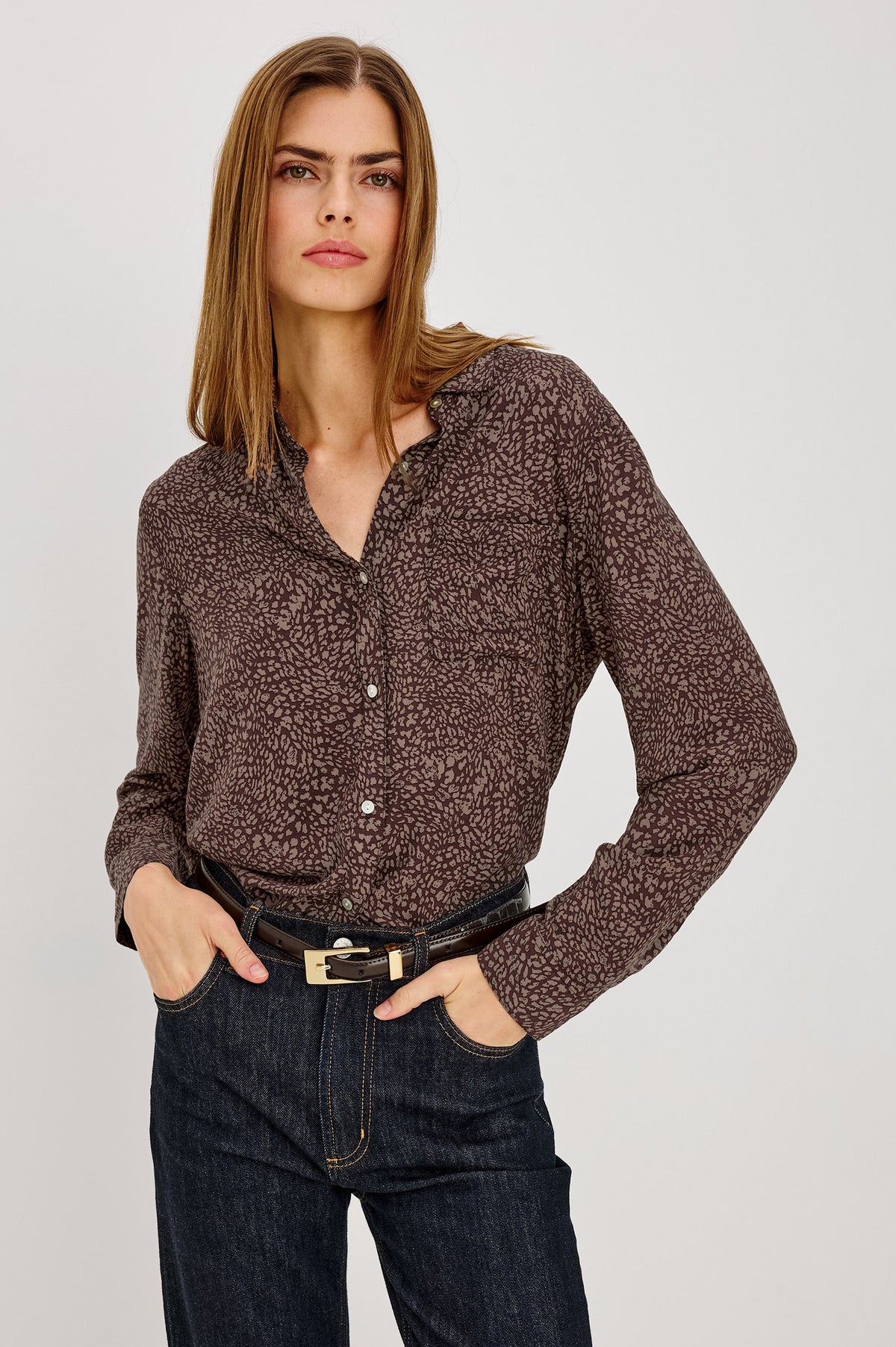 Model wearing Rails Josephine button-down shirt in cocoa mini cheetah print with dark jeans