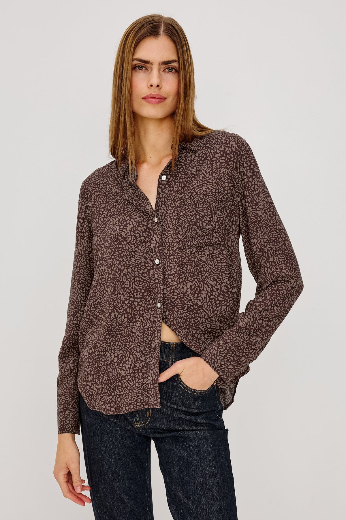 Woman wearing Rails Josephine long-sleeve button-down shirt in cocoa mini cheetah print with dark jeans