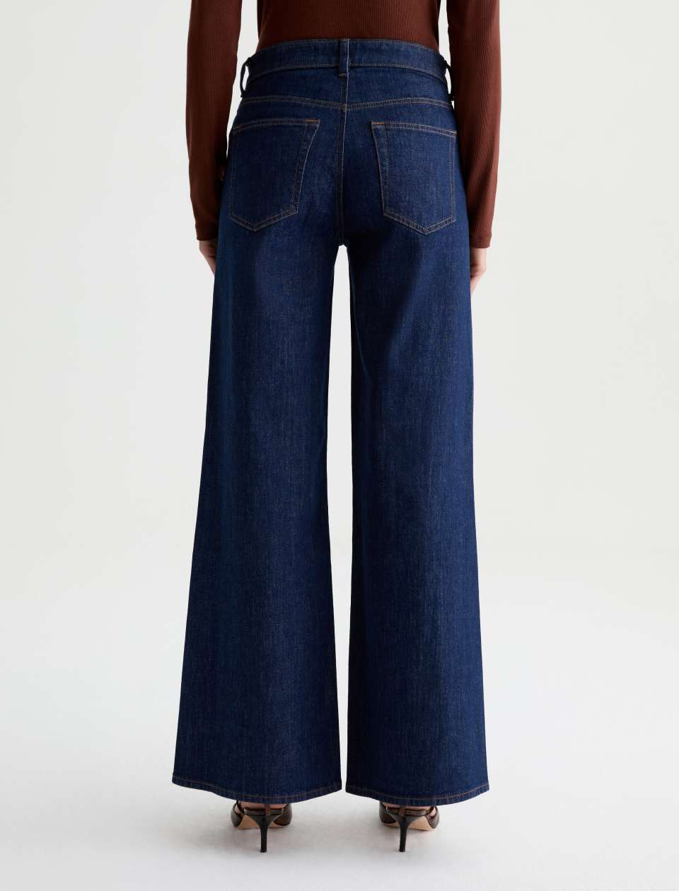 AG Saige wide leg dark wash blue jeans with back pockets, rear view