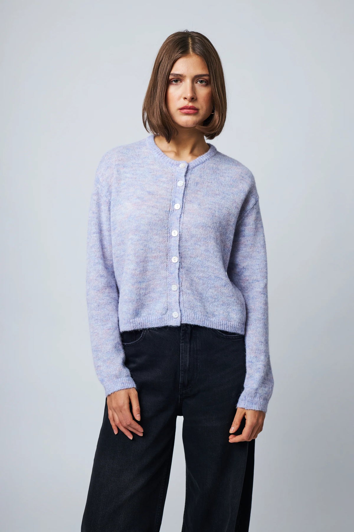 Lavender mist button-front knit cardigan with ribbed cuffs and hem, worn with dark jeans.