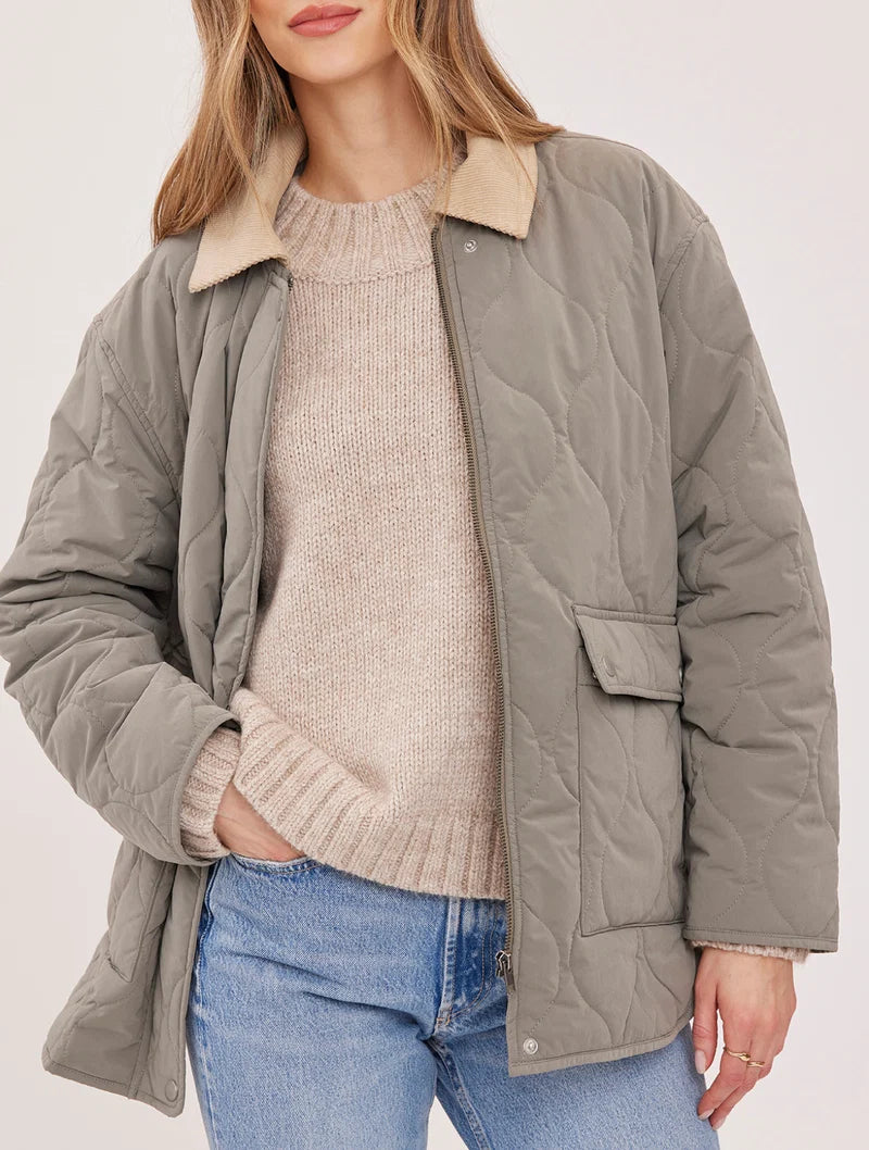 Gentle Fawn Felix sage quilted jacket with corduroy collar, worn open over cream sweater
