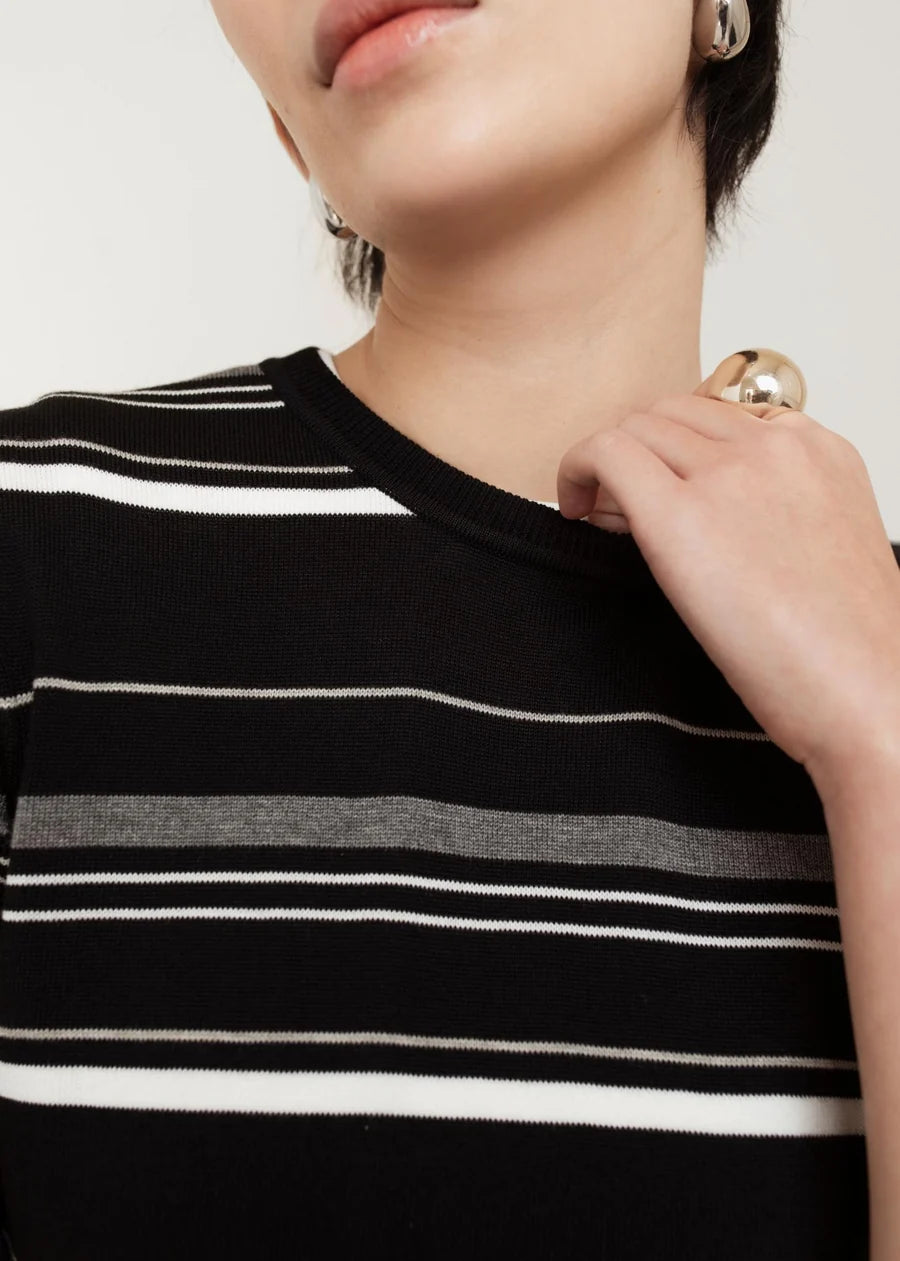Black striped knit crew neck top with white and grey horizontal stripes