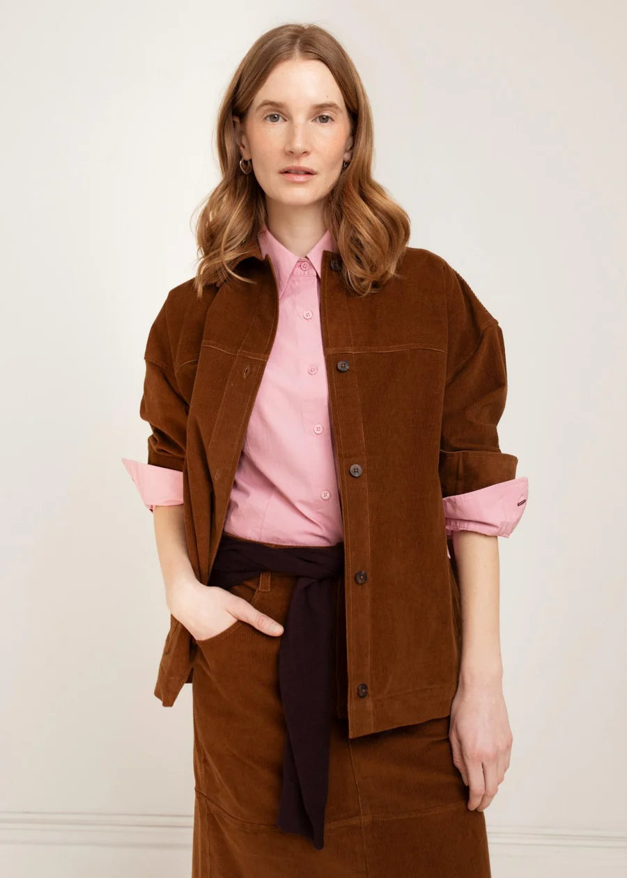 Brown corduroy button-front shirt jacket with chest pockets and rolled sleeves
