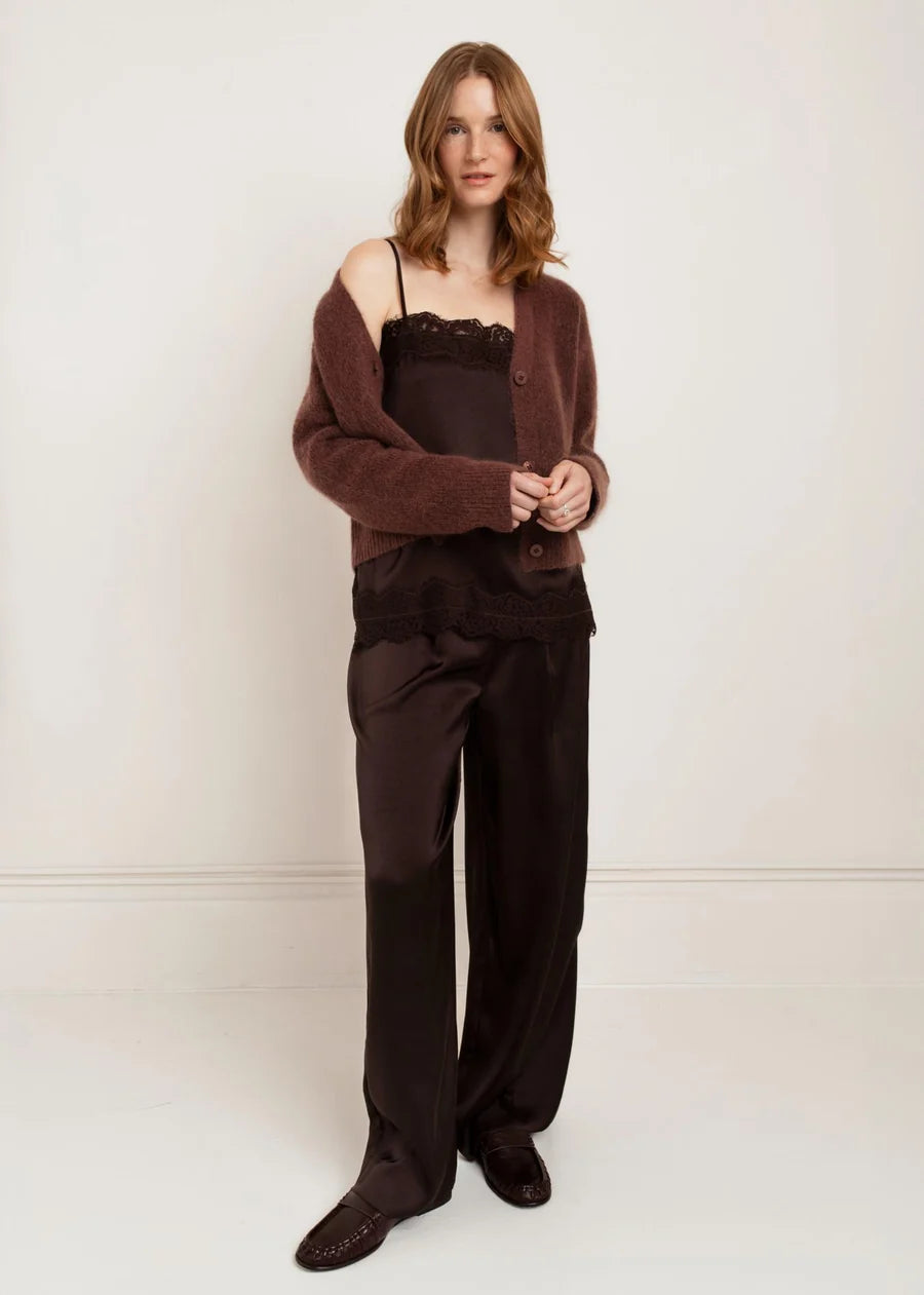 Dark brown satin lace-trim cami with thin straps, worn under a cardigan