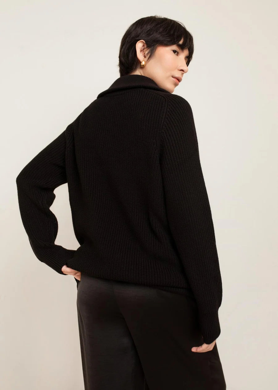 Black ribbed knit funnel neck zip sweater, back view, long sleeves