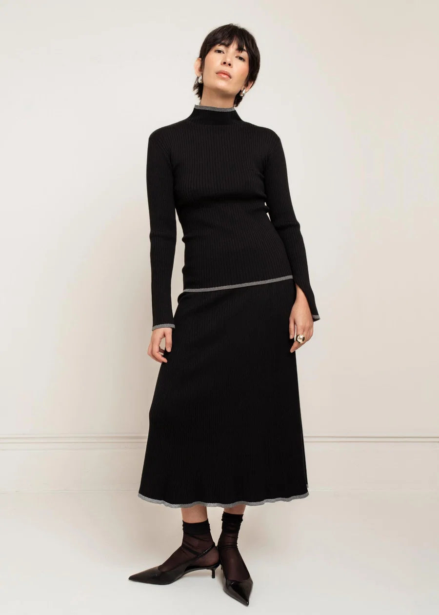 Black ribbed knit midi skirt with silver lurex trim, A-line silhouette