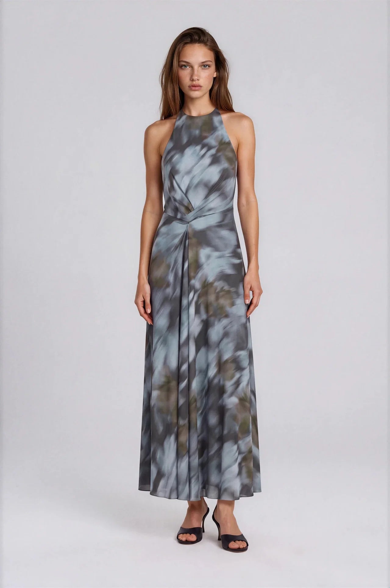 Maxi halter dress in grey-blue abstract floral print with twist waist detail