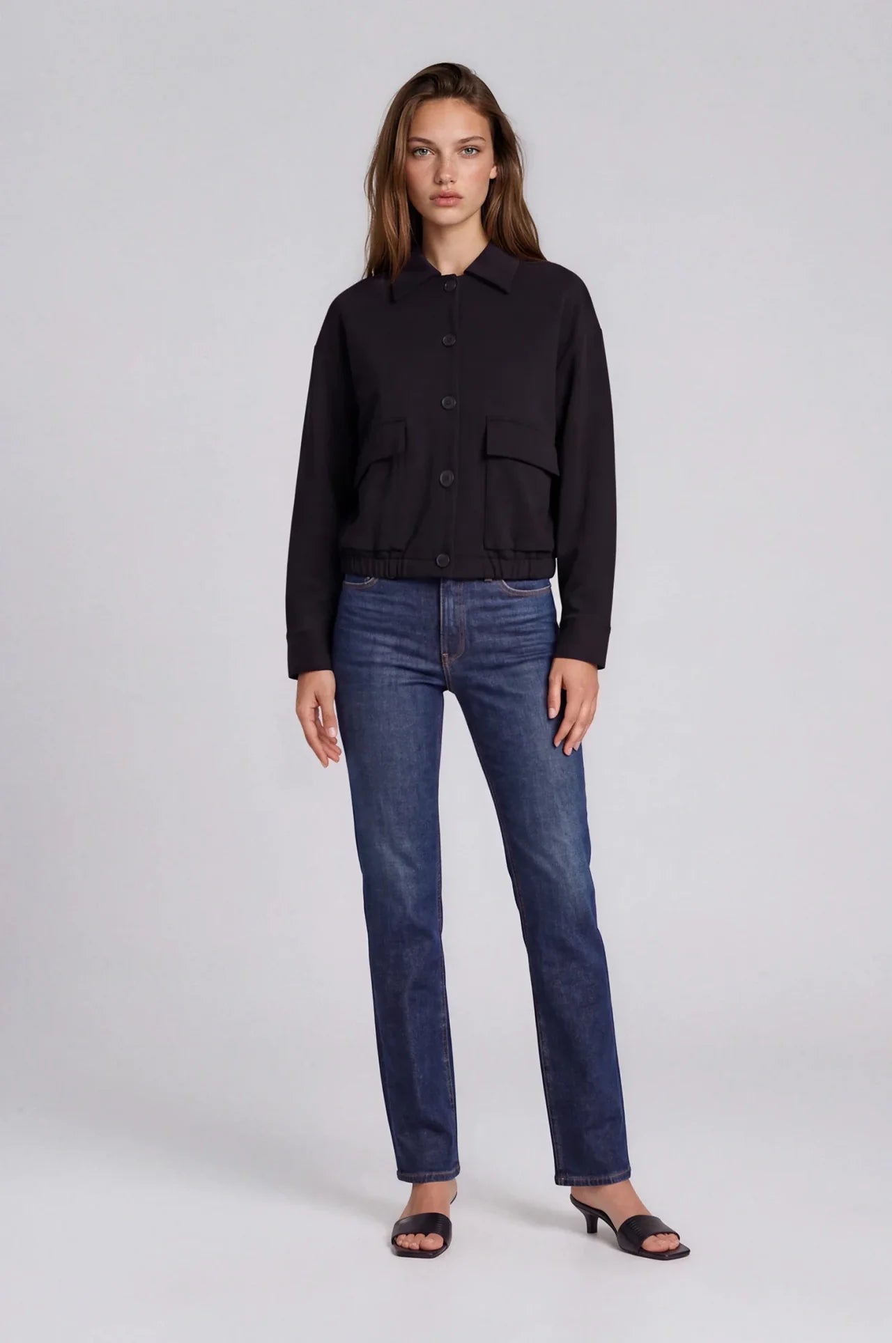 Black scuba bomber jacket with button front, collar, and flap pockets