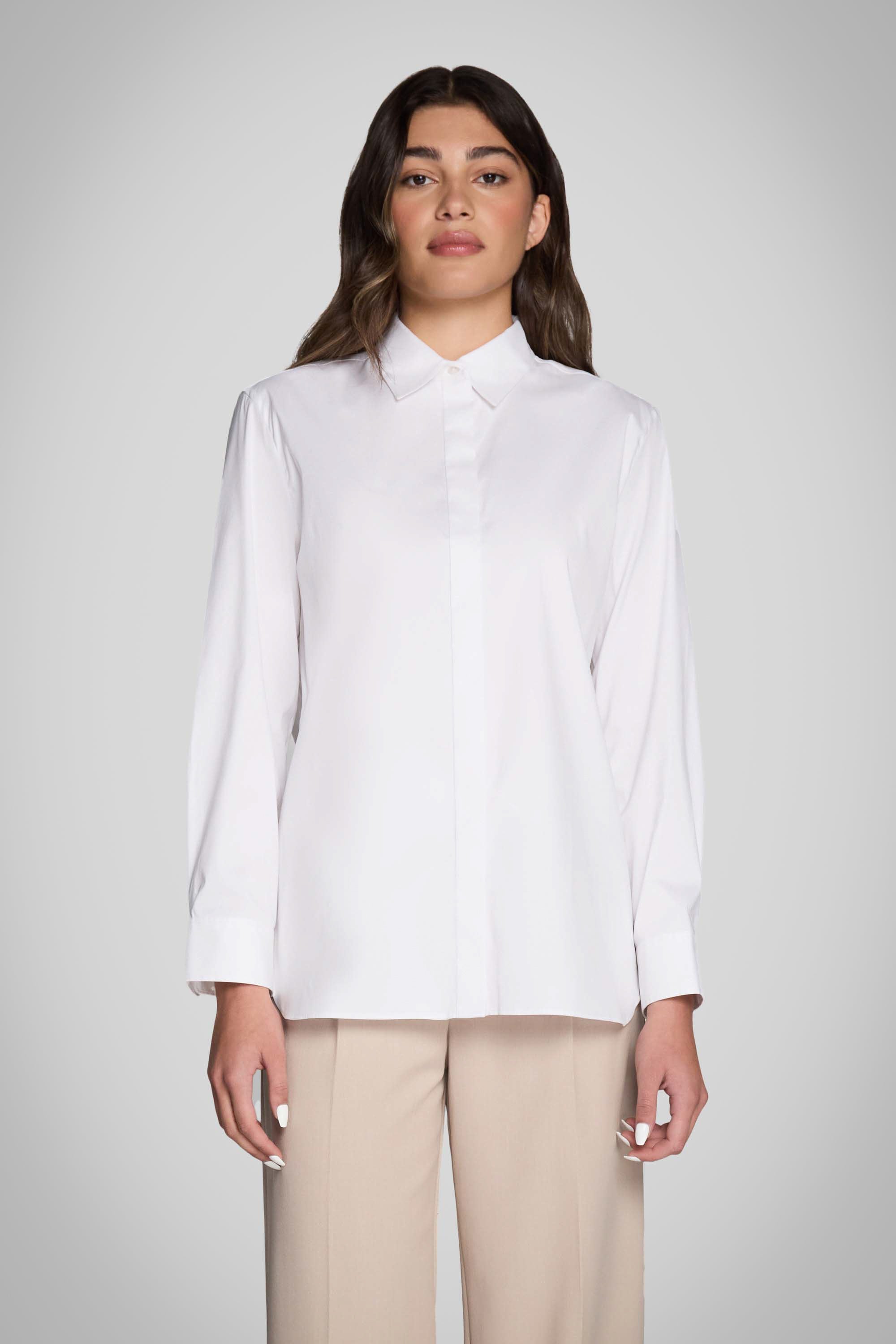 Woman wearing Pure & Simple white classic long-sleeve button-up shirt with collar