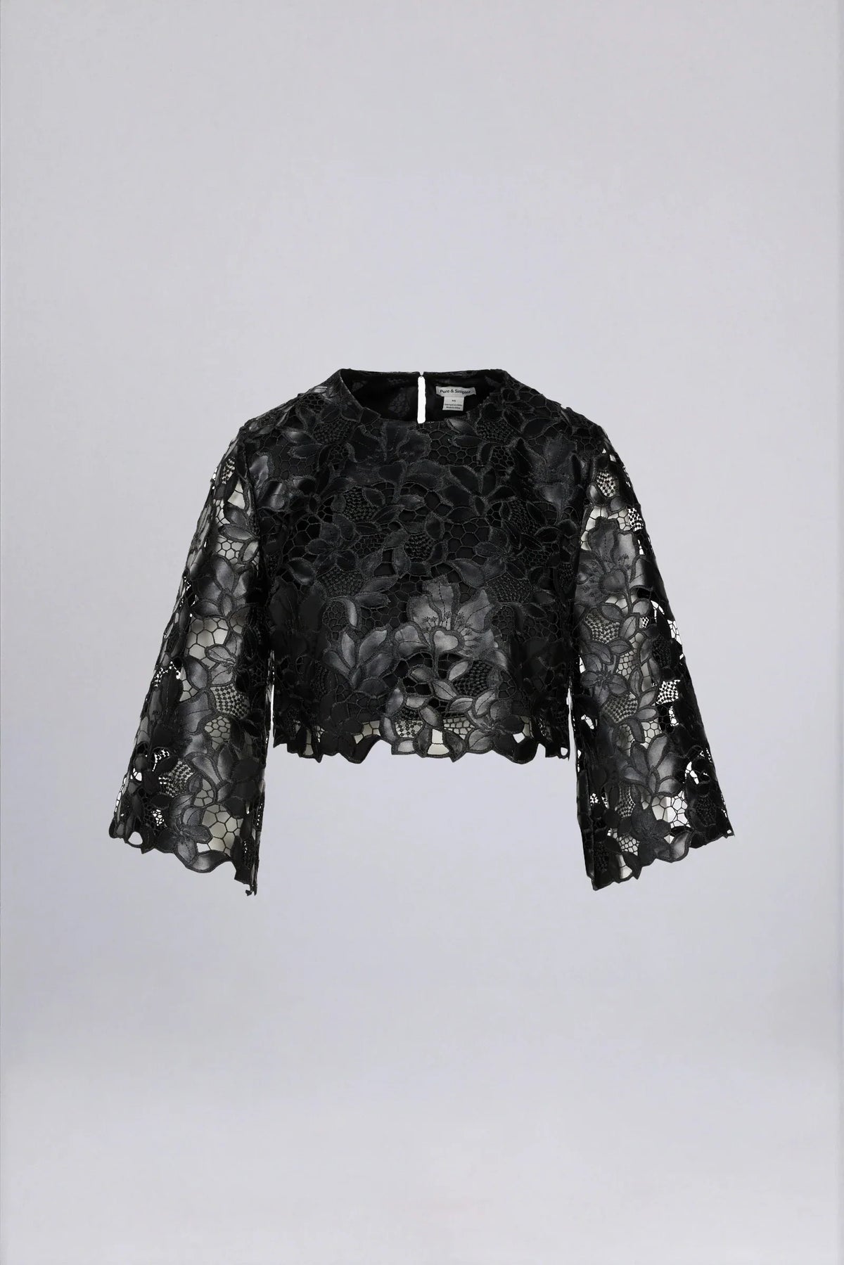 Black lace embroidered crop top with floral pattern and wide bell sleeves on white background